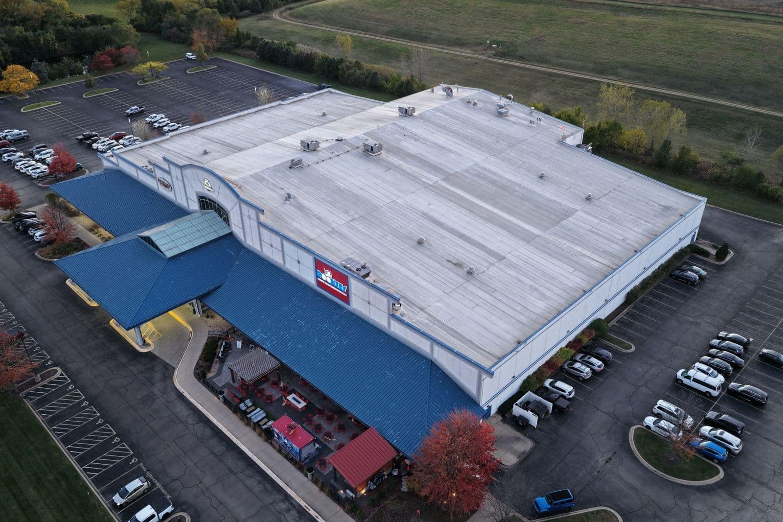 Aerial view of a large commercial building with a new single-ply membrane roof