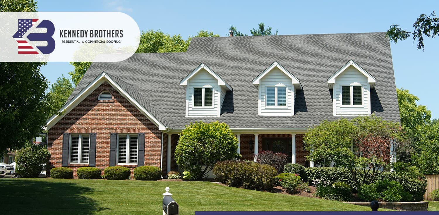 Completed residential roof on a brick home