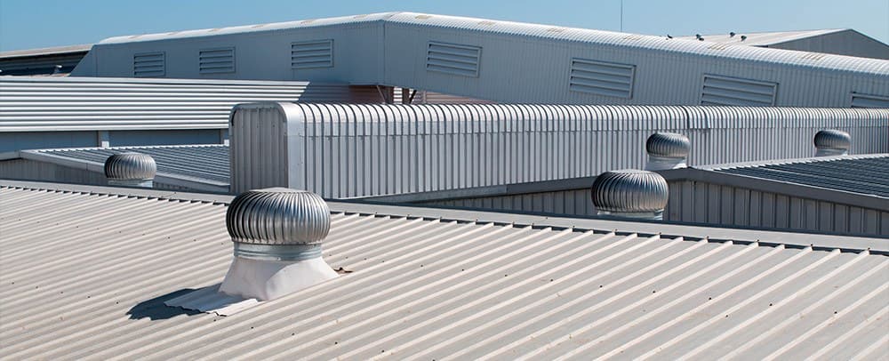 Commercial standing-seam metal roof with ventilation
